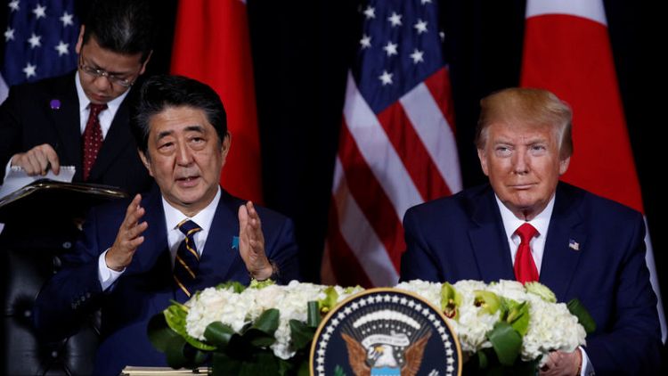 Japan's Abe - Will make preparations for January trade deal with U.S.