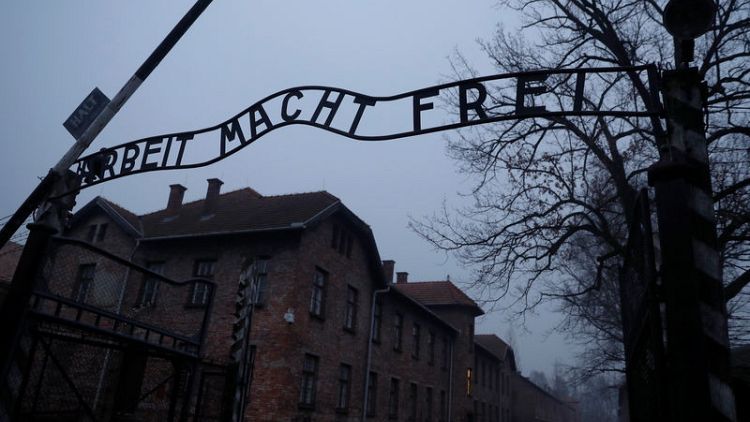 Merkel to give Auschwitz 60 million euros from Germany during first visit