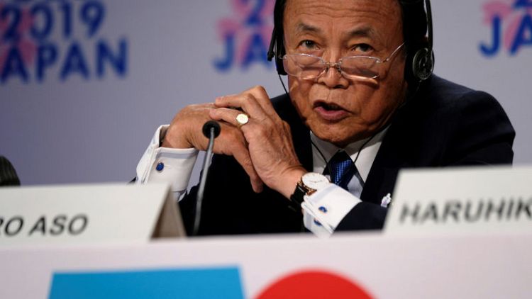 BOJ's low-rate policy not behind megabank's fee moves - Aso
