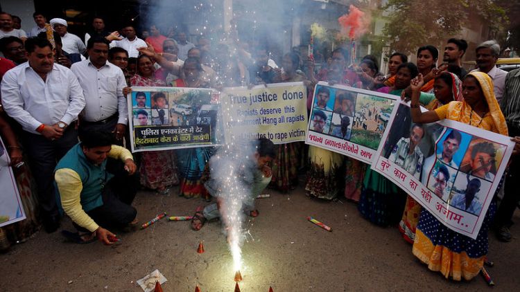 Indian police kill four men suspected of rape, murder, drawing applause and concern