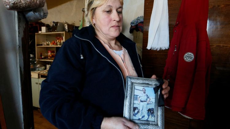 Ukraine rebel's widow finds husband's remains by road five years on