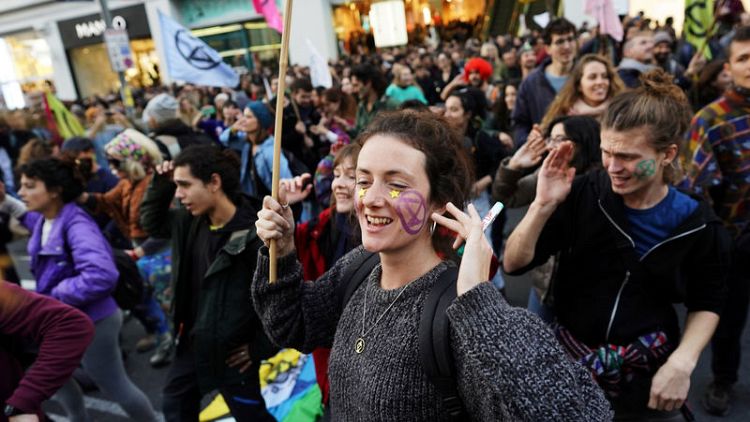 Dancing crowds protest in Madrid while climate leaders meet