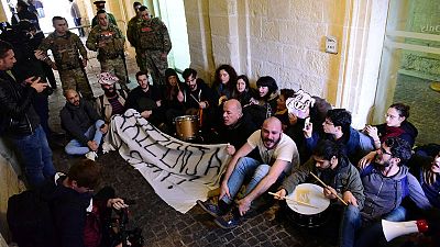 Activists storm into Maltese government HQ demanding PM's resignation Activists storm into Maltese government HQ demanding PM's resignation