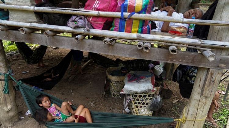 Thousands of Myanmar villagers poised to flee violence to Thailand, group says