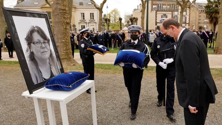 French PM pays tribute to slain police worker