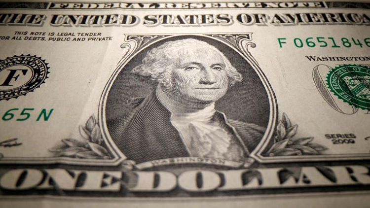 Dollar holds firm as Fed hawks urge early taper ahead of Powell's speech