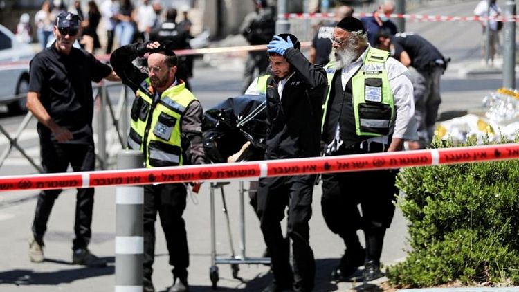 Two Israelis stabbed, assailant shot near Jerusalem flashpoint - police