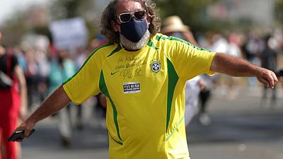 Brasileños organizan protestas alrededor del país contra la respuesta de Bolsonaro al COVID-19 Brasileños organizan protestas alrededor del país contra la respuesta de Bolsonaro al COVID-19