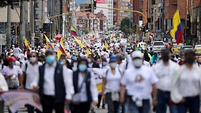Thousands march in Colombia's Bogota to demand end to protests, roadblocks Thousands march in Colombia's Bogota to demand end to protests, roadblocks