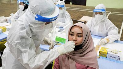 Southeast Asia's coronavirus surge prompts shutdowns and alarm Southeast Asia's coronavirus surge prompts shutdowns and alarm