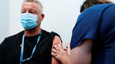 Factbox - Countries make COVID-19 vaccines mandatory