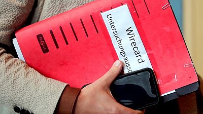 German parliament criticizes Scholz and Merkel over Wirecard - draft report German parliament criticizes Scholz and Merkel over Wirecard - draft report
