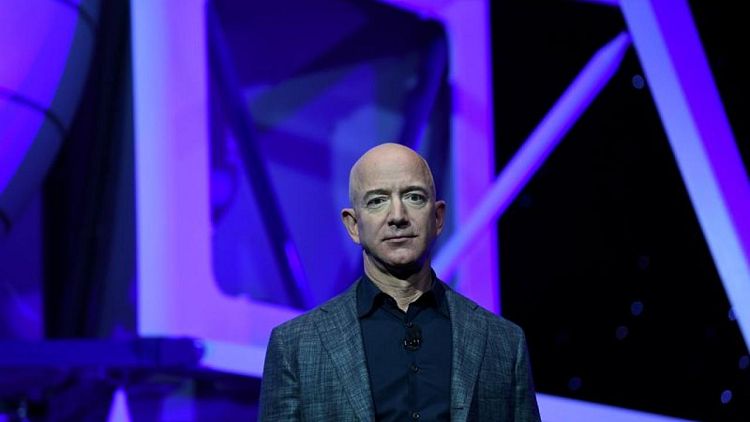 Factbox: Jeff Bezos' journey from suburban garage to edge of space