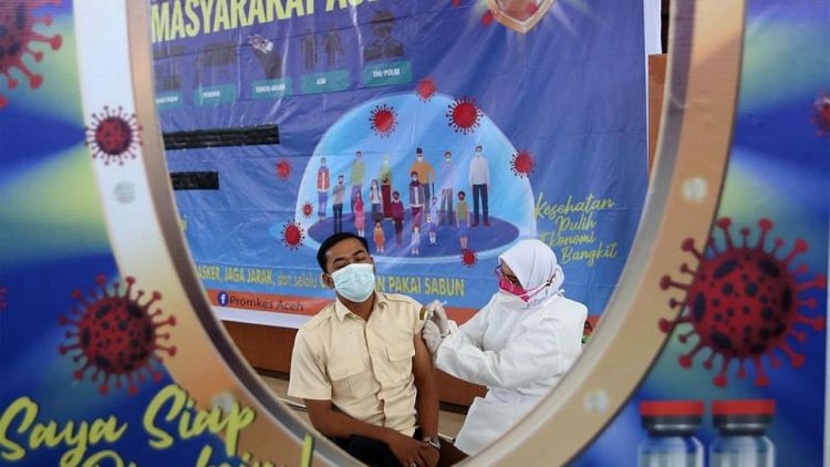 Indonesia aims to speed up vaccinations as Jakarta opens to over 18s