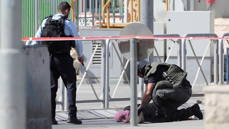 Israeli guard shoots dead a knife-wielding Palestinian woman, police say