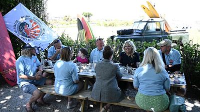 Surfboards and calming waters, U.S. first lady meets UK military veterans Surfboards and calming waters, U.S. first lady meets UK military veterans