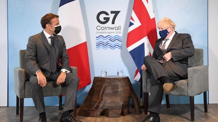 EU and UK's 'sausage war' sizzles at G7 as Macron and Johnson spar
