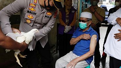 Chickens, cows, apartments offered up in Asia's vaccination lucky draws Chickens, cows, apartments offered up in Asia's vaccination lucky draws