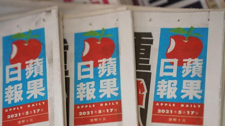 HK national security police arrest Apple Daily directors, seize reporting materials