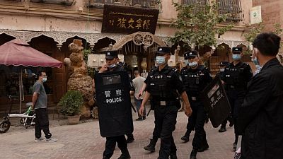 In China's new Xinjiang: patriotic tourism, riot police and minders In China's new Xinjiang: patriotic tourism, riot police and minders