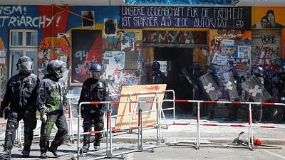 Berlin police force entry to long-time squat under hail of fireworks, smoke bombs Berlin police force entry to long-time squat under hail of fireworks, smoke bombs