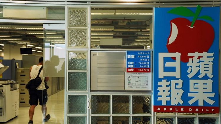 HK pro-democracy tabloid Apple Daily increases production after police raid
