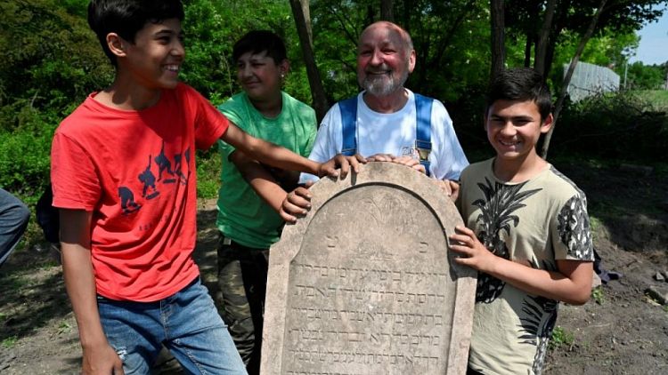 Roma boys help restore forgotten Slovak Jewish cemetery