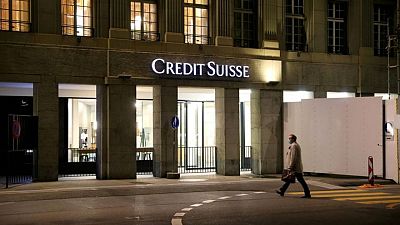 Fearing predators, Credit Suisse seeks new look or even merger - sources