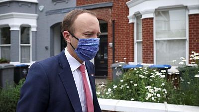UK health minister 'very sorry' after pictured kissing aide UK health minister 'very sorry' after pictured kissing aide