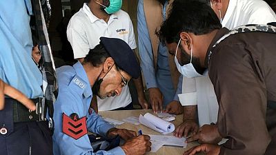 Desperate expatriate workers storm Islamabad vaccination centre Desperate expatriate workers storm Islamabad vaccination centre