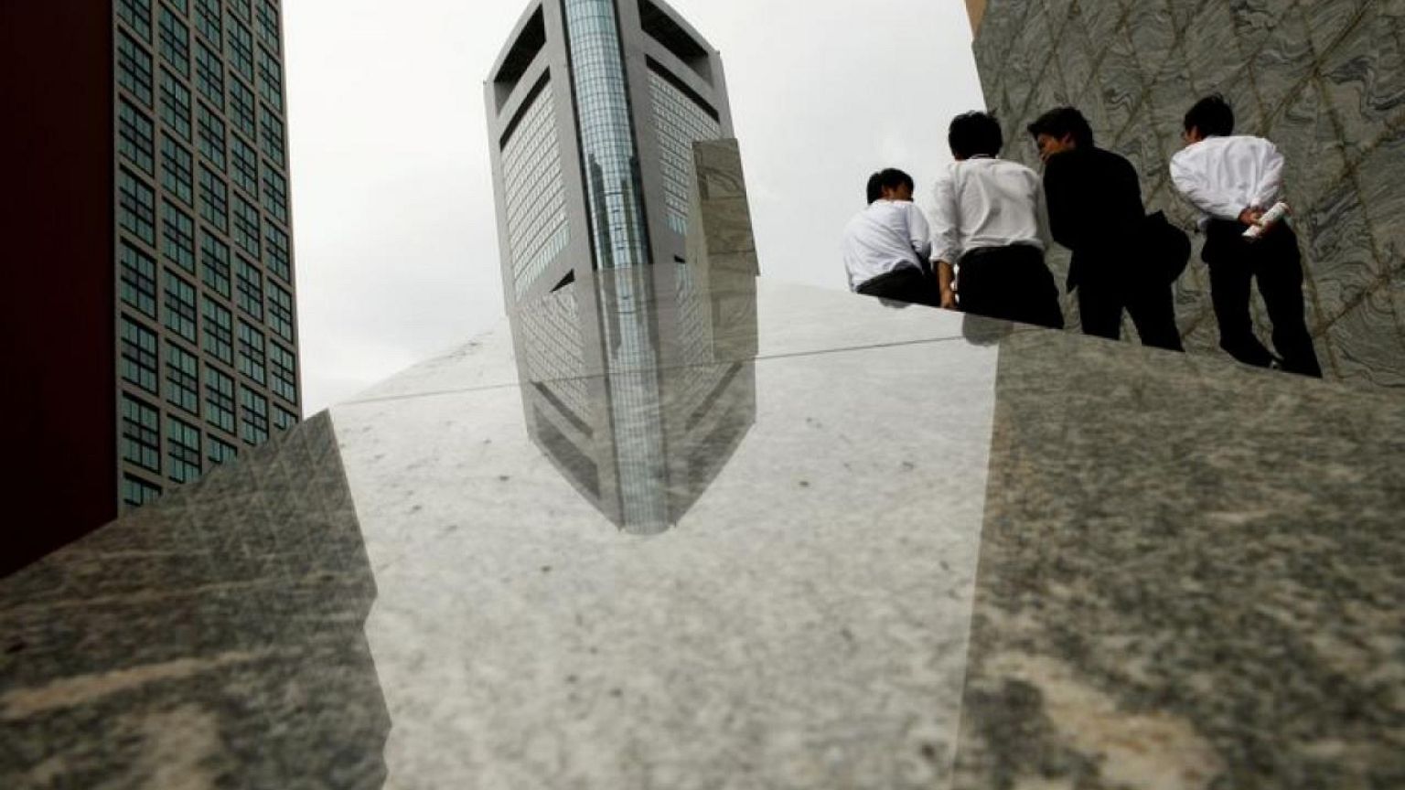Japan's service sector activity contracts for 17th month as pick-up stalls