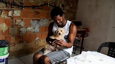 Scholar by day, street-sweeper by night, one Black man navigates Rio's racial divide Scholar by day, street-sweeper by night, one Black man navigates Rio's racial divide