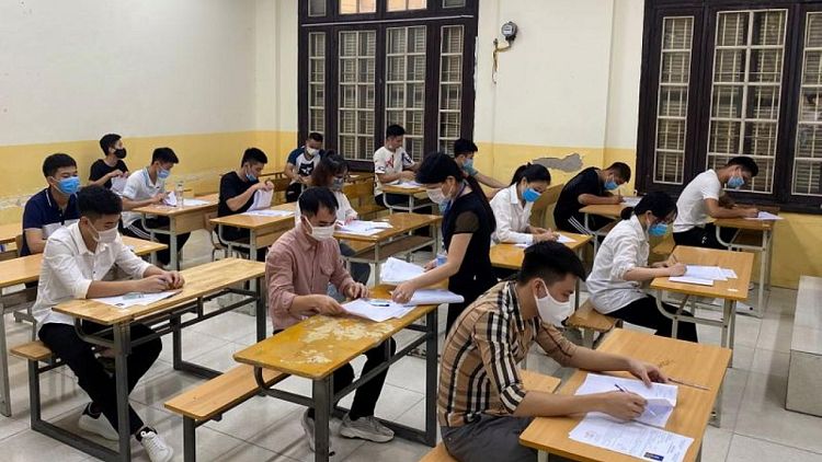 Vietnam students turn out for exams under coronavirus cloud