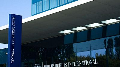 Cigarette maker Philip Morris to buy UK producer of respiratory treatments Cigarette maker Philip Morris to buy UK producer of respiratory treatments