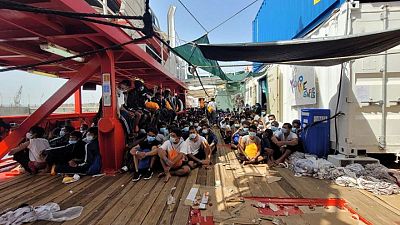 Nearly 600 rescued migrants disembark from charity boat in Italy Nearly 600 rescued migrants disembark from charity boat in Italy