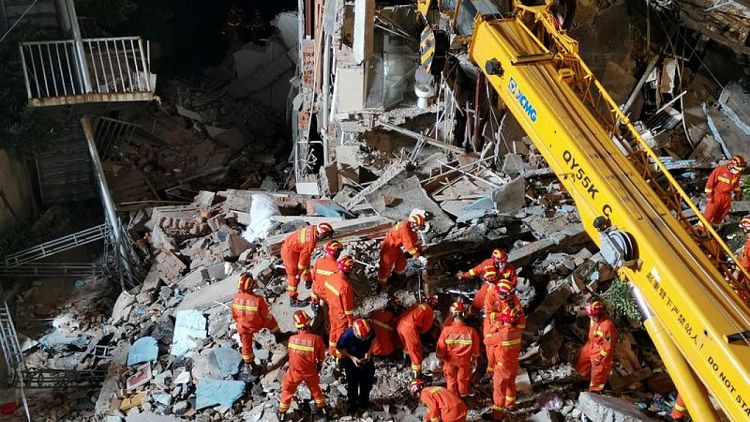 China hotel collapse kills eight; rescuers search for nine missing