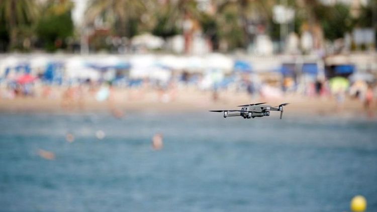 As Spain's beaches fill up, a seaside resort sends in the drones