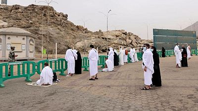 Masked haj pilgrims on Mount Arafat pray for COVID-free world Masked haj pilgrims on Mount Arafat pray for COVID-free world