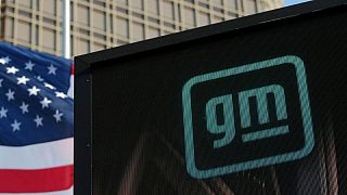 GM profit posts profit, raises full-year outlook