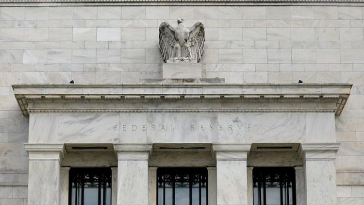 RESUMEN-Fed dice economía sigue "fortaleciéndose" y cita avances en metas para reducir compra de bonos