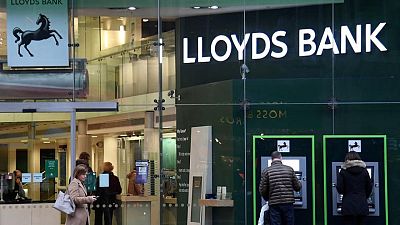 Lloyds swings to half-year profit, announces dividend Lloyds swings to half-year profit, announces dividend