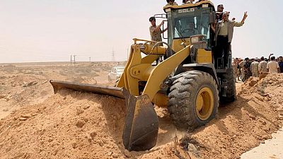 Libya's combatants declare key coast road open Libya's combatants declare key coast road open