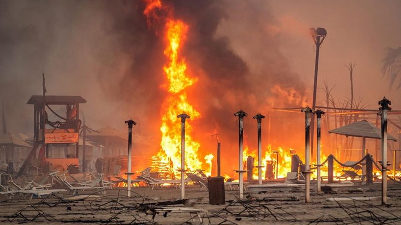 Firemen fighting wildfires in Sicilian town of Catania