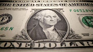Dollar near one-week low as Delta fears ease before Jackson Hole