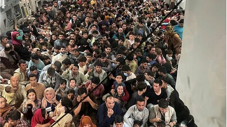 Evacuation flights restart from Kabul after Afghans desperate to flee cleared from airfield