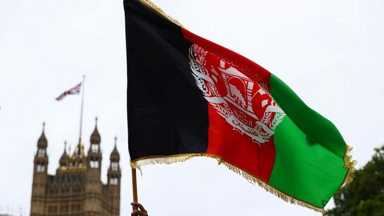 UK suspends official for error revealing Afghan interpreter details