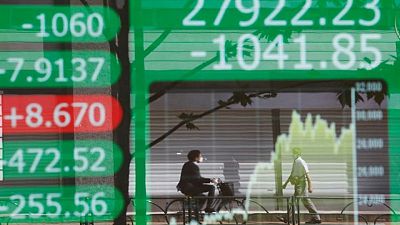 Asian shares fall further, dollar stays strong