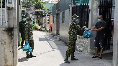 Vietnam urges WHO to send more COVID-19 shots as cases surge despite lockdown