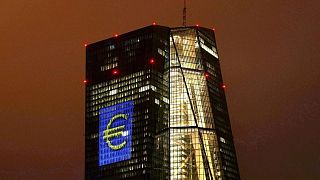 Euro zone bond yields slip, stocks and euro rise as ECB slows support