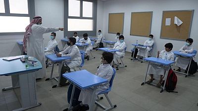 Saudi students return to school with masks and checks